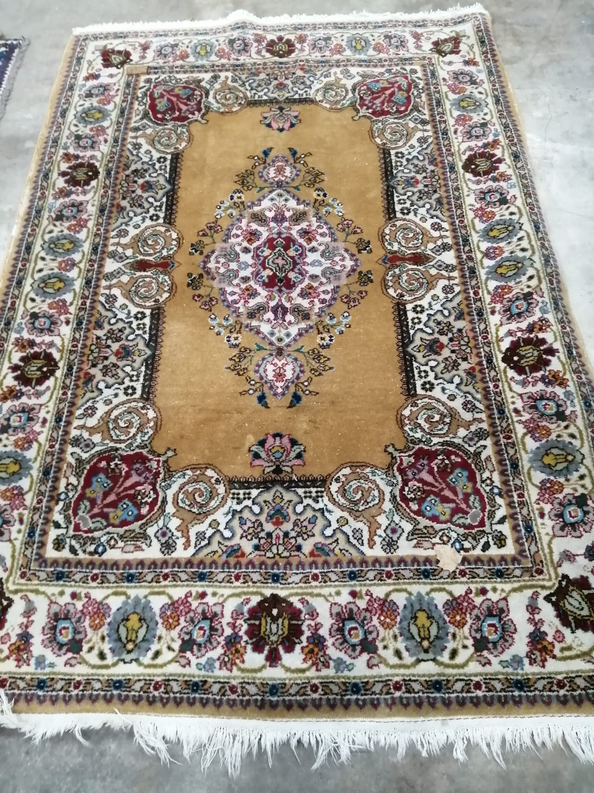 A North West Persian gold ground carpet, 200 x 136cm